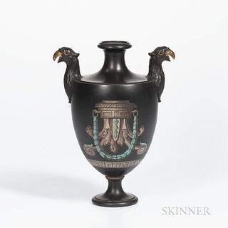 Encaustic and Gilded Black Basalt Vase, England, 19th century, molded bird handles, iron, red, black and white with shaped cartouche of