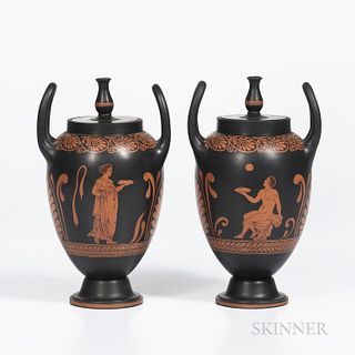 Pair of Wedgwood Encaustic Decorated Black Basalt Vases with Covers, England, 19th century, urn finials and upturned loop handles, iron