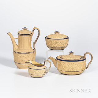 Four Turner Caneware Tea Wares, England, c. 1800, each with blue enamel trim and molded arabesque floral bands, a marked Turner coffeep