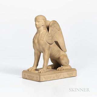 Wedgwood Caneware Sphinx, England, late 18th/early 19th century, modeled seated atop a rectangular base set with Egyptian motifs in rel