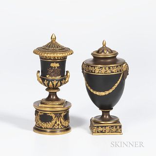 Two Wedgwood Gilded and Bronzed Black Basalt Vases and Covers, England, c. 1885, one with laurel festoons terminating at Bacchus heads