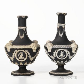Two Wedgwood Black Jasper Dip Barber Bottles, England, 19th century, each with applied white relief including a beadwork band above flo