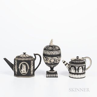 Three Black Jasper Dip Items, England, 19th century, each with applied white classical relief, a marked Wedgwood cup and cover, ht. 8 3