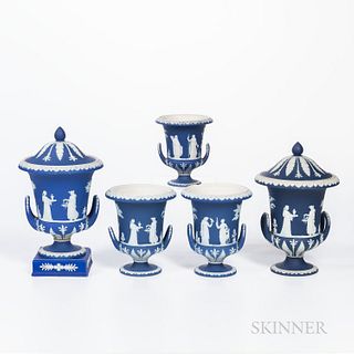 Five Wedgwood Dark Blue Jasper Dip Vases, England, late 19th and early 20th century, each with upturned loop handles and applied white