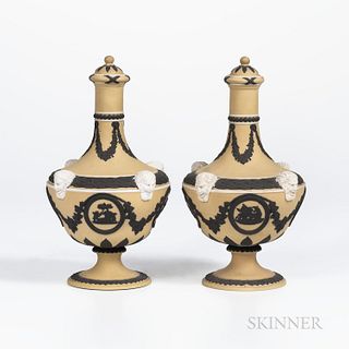 Pair of Wedgwood Tricolor Jasper Dip Barber Bottles and Covers, England, c. 1930, yellow ground with applied white Bacchus heads to sho