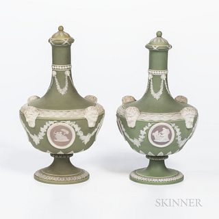 Two Wedgwood Tricolor Jasper Dip Barber Bottles and Covers, England, 19th century, each with applied white relief, green ground and lil