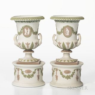 Pair of Wedgwood Tricolor Jasper Urns, England, 19th century, solid white with applied lilac, green and white, the urns with upturned l