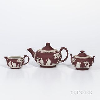 Assembled Three-piece Wedgwood Crimson Jasper Dip Tea Set, England, early 20th century, each with applied white classical figures in re