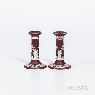 Pair of Wedgwood Crimson Jasper Dip Candlesticks, England, early 20th century, applied white classical figures in relief, impressed mar