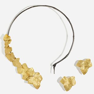 Silver and gold asymmetrical leaf necklace and earrings