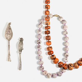 Two coral bead necklaces with two Ilana Goor 'African' brooches