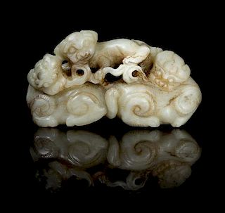 A Carved Jade Figural Group Length 3 1/2 inches.