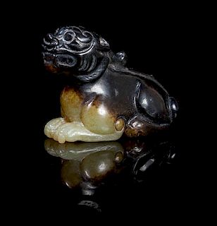 A Celadon and Brown Jade Carving of a Bixie Length 2 inches.