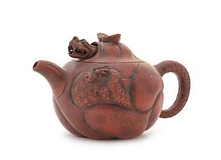 A Yixing Pottery Teapot Height 3 3/8 x width over handle 6 inches.