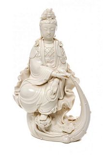 * A Blanc-de-Chine Porcelain Figure of Guanyin Height 12 1/4 inches.
