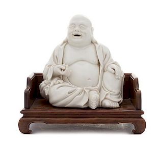 * A Blanc-de-Chine Porcelain Figure of Mile Buddha LIKELY 19TH CENTURY OR EARLIER Height 17 inches.