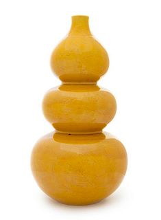 A Yellow Glazed Porcelain Triple Gourd-Form Bottle Vase Height 16 1/2 inches.
