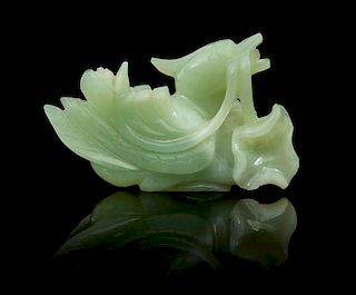 * A Carved Jade Toggle Length 3 7/8 inches.