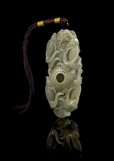 * A Carved Jade Toggle Length 2 7/8 inches.