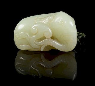* A Carved Jade Toggle Length 2 inches.