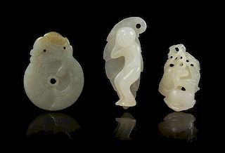 * Three Carved Jade Toggles Length 2 1/4 inches.