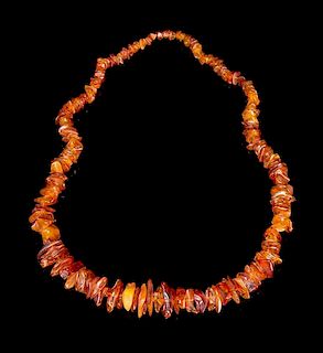 An Amber Beaded Necklace Length overall 18 1/2 inches.