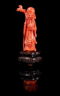 A Carved Coral Figure of Shoulao Height overall 3 5/8 inches.