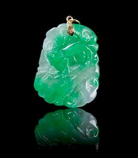 A Carved Jadeite Pendant Height 1 3/4 inches.