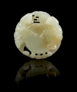 * A Carved Jade Pendant Diameter 2 inches.