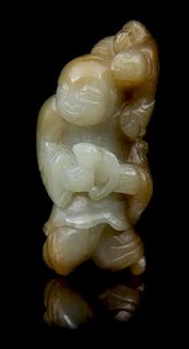 * A Carved Jade Toggle Length 2 3/4 inches.