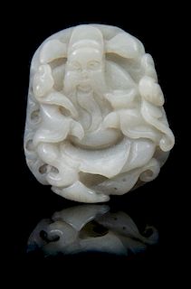 * A Carved Jade Toggle Length 2 1/4 inches.