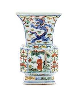 * A Wucai Porcelain Faceted Gu-Form Vase LIKELY 19TH CENTURY Height 7 3/8 inches.