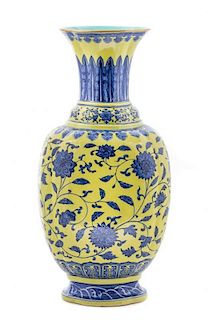 A Yellow and Underglazed Blue Porcelain Vase Height 19 inches.