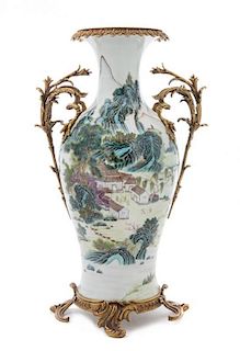 A Polychrome Enameled Gilt Metal Mounted Porcelain Vase LIKELY EARLY 20TH CENTURY Height 20 1/4 inches.