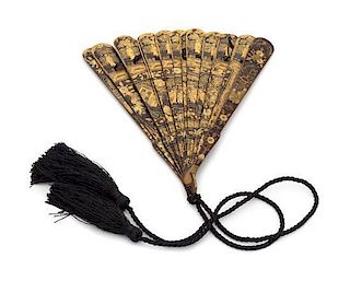 A Gilt Decorated Black Lacquer Fan Height 8 1/8 inches.