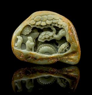 * A Carved Celadon Jade Boulder Height 4 1/8 x width 5 1/2 inches.