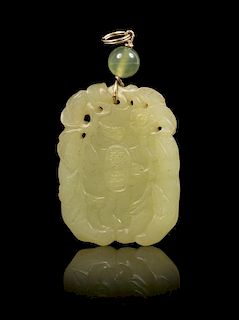 A Yellow Jade Pendant Height of pendant 1 3/4 inches.