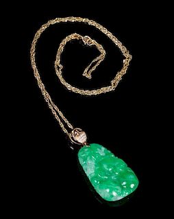 An 18 Karat Gold, Diamond and Jadeite Pendant Height of jadeite 1 1/8 inches.