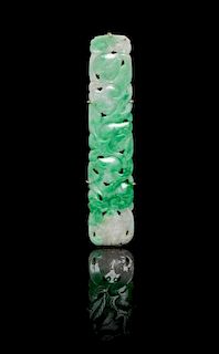 * A Carved Jadeite Pendant Length 2 7/8 inches.