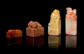 A Group of Four Soapstone Seals Height of tallest 3 inches.
