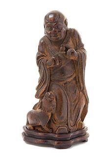 A Carved Bamboo Figure of an Immortal Height overall 8 1/4 inches.