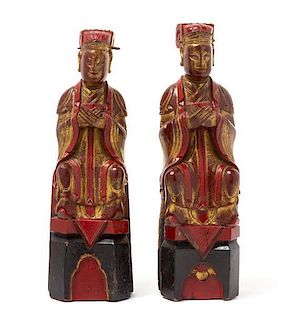 * A Matched Pair of Gilt, Red and Black Lacquered Wood Figures of Scholars Height 11 7/8 inches.