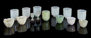 * A Collection of Fourteen Jade and Jadeite Cups Height of tallest 2 3/8 inches.