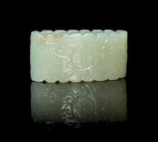 A Carved Jade Sword Slide Length 2 inches.