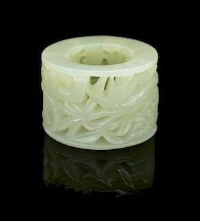 * A Carved Jade Archer's Ring Diameter 1 3/8 inches.