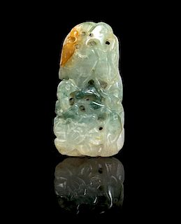 * A Carved Jadeite Pendant Height 2 inches.