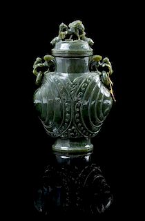 A Carved Spinach Jade Vase Height 7 1/4 inches.
