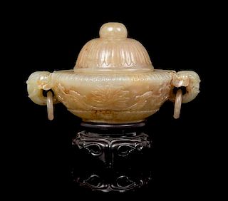 A Mughal-Style Carved Jade Jar and Cover Height of jade 3 1/2 x width over handles 5 7/8 inches.