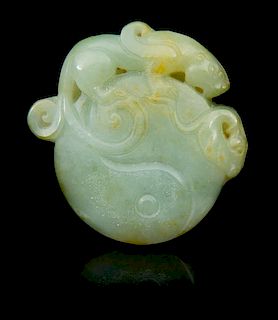 * A Carved Jade Toggle Length 1 7/8 inches.