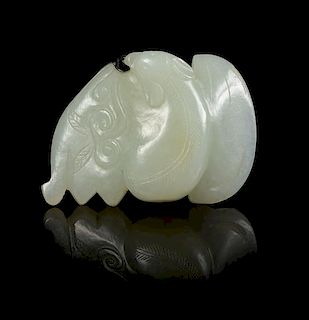 * A Carved Jade Pendant Width 2 1/2 inches.